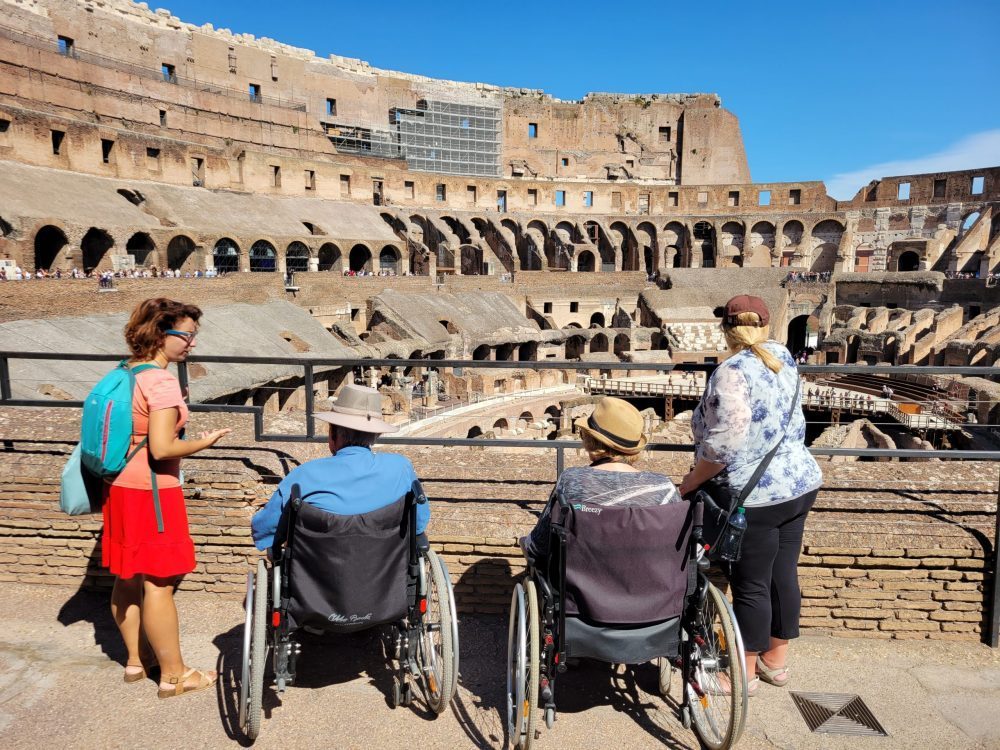 wheelchair users enjoying a tour at the Colosseum